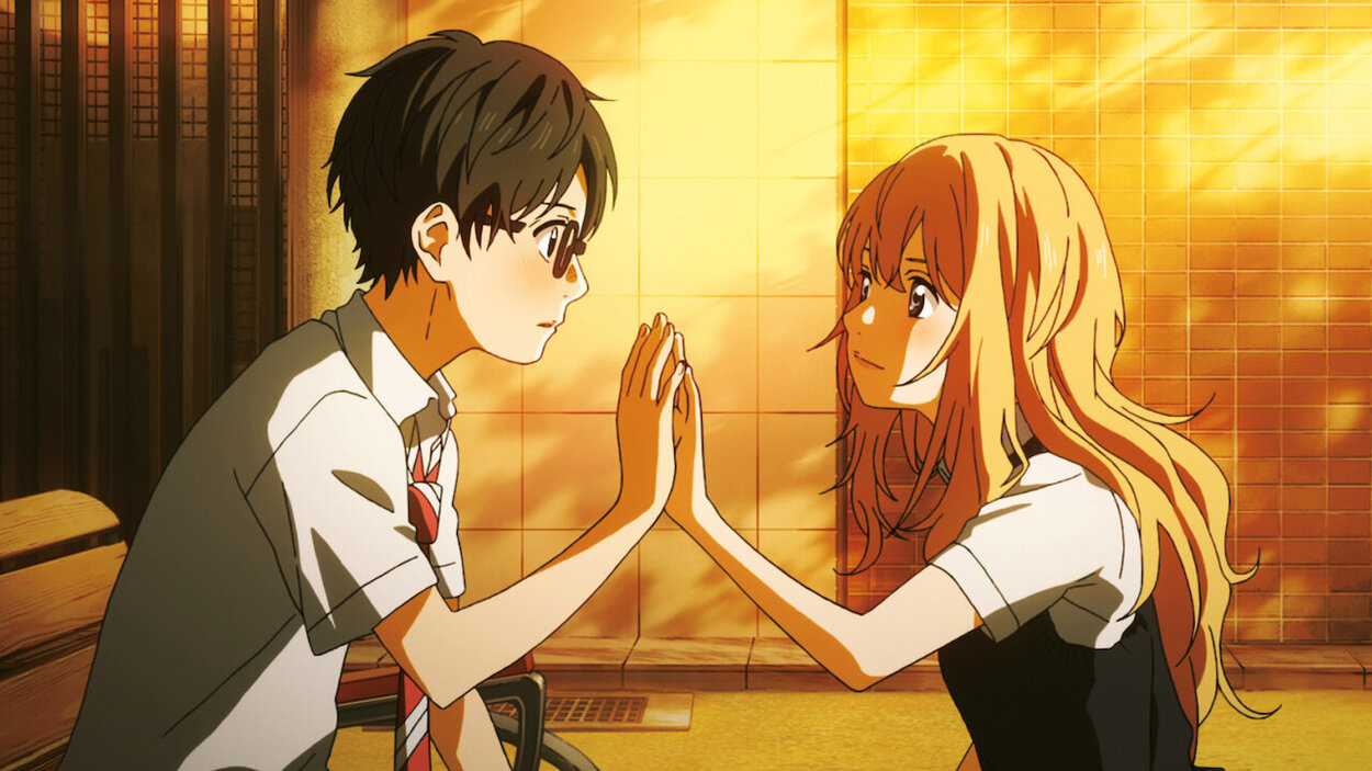 The male and female lead of the Anime touching eachother's hands.