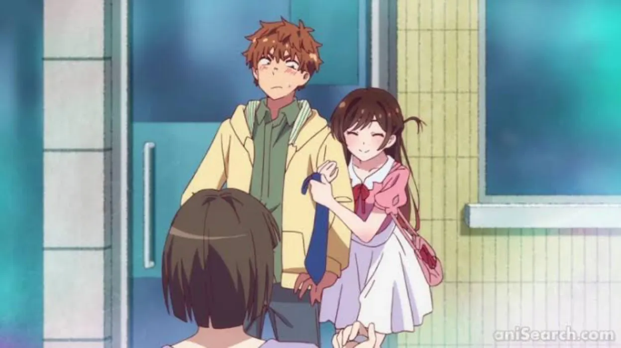 Kazuya and Chizuru together, with Chizuru holding Kazuya's arm.