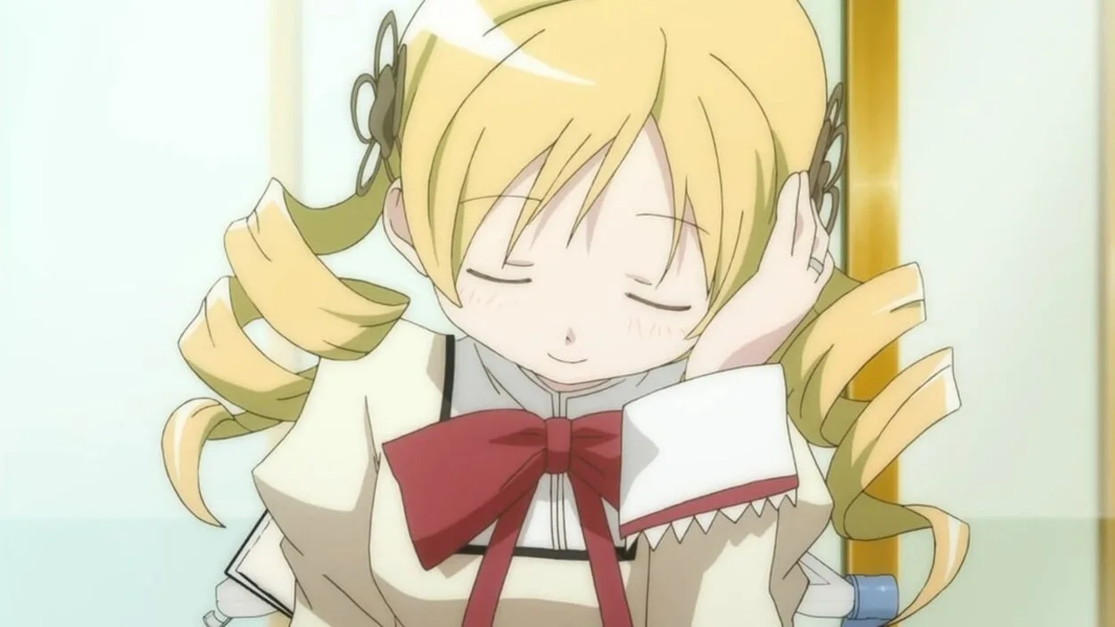 Mami Tomoe looks shy while her head rests on her hand.