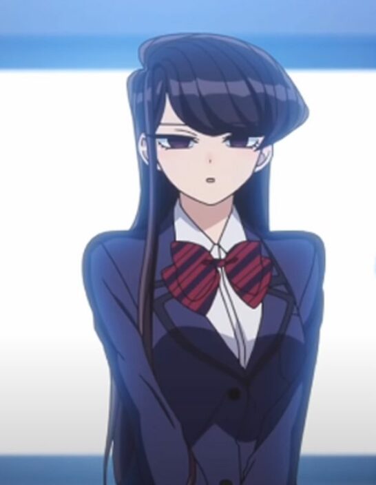 Komi from Komi Can't Communicate in her uniform standing against a window